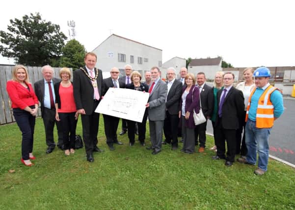 Mayor Colin McCusker, Dennis Loney chairman of Brownlow Neighbourhood Renewal Partnership, Dian Heaney Chairperson from Bluestone Business Ltd & Minister McCausland pictured with all those involved with the new business units to be built at Bluestone Business Park. INLM35-856