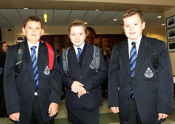 Peter Stevenson, Casey Leigh Tosh and Jack Robinson were delighted to start Year 8 at Limavady Grammar school as the new school term started on Monday. INLV3514-647KDR