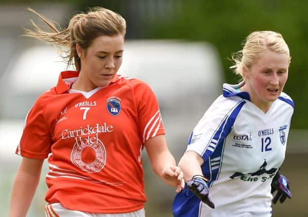 Niamh Henderson (left) on the ball for Armagh in the ladies clash with Waterford this season. Pic by Sportsfile.