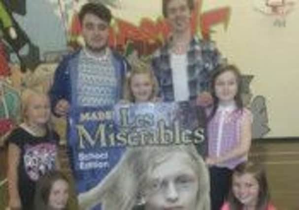 Ethan Lawlor and Jack Watson with some of the young Cosettes and Eponines for Les Miserables