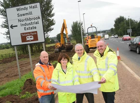 Pictured are Tommy Henry, Patrick Bradley Ltd, Deidre Mackle, DRD Transport NI Divisional Roads Manager, Transport Minister Danny Kennedy and Bryan Daly, DRD Transport NI Consultancy.