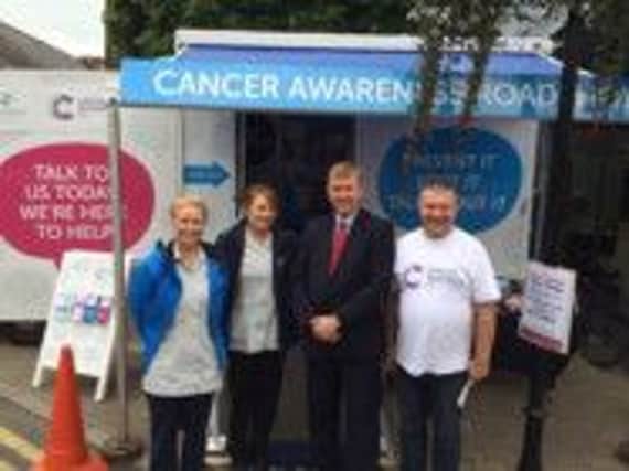 Cllr Mervyn Storey supports Cancer Research Roadshow which was in Ballymoney recently to raise funds and promote the charity. Cllr Storey is pictured with Ivor Wallace and Cancer nurses. Next weeks van pull and street collection is hoping to raise vital funds for the charity.  inbm37-14s