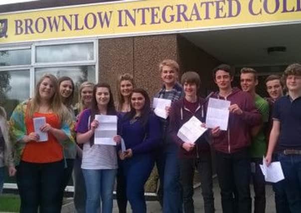 Successful GCSE students at Brownlow Integrated College with teacher Steven Porter. INPT36-038