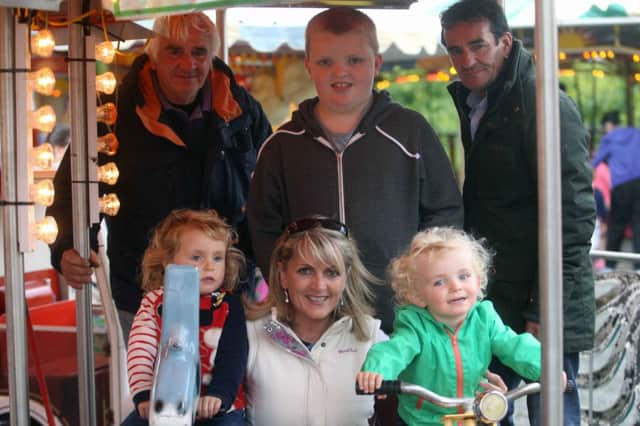 Brendan and Stephanie McLaughlin with some of their customers  during the free evening on the McLaughlins Amusements at Ballycastle as a thank you for the support over the Lammas Fair period