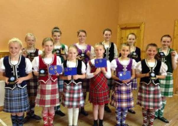 Dance students from Donegal, who are students of Georgina Kee-McCarter, choreographer with Sollus Highland Dance, with their medals and certificates.