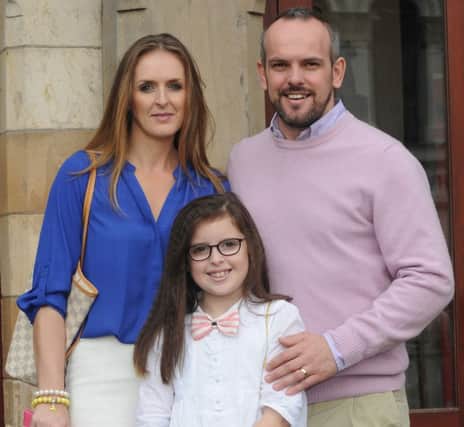 Former NI International footballer Stuart Elliott pictured with his wife Laura-Lee and their daughter Hannah-Grace.