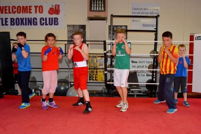 Kids from Castle Boxing Club in Carickfergus warming up before a training session. INCT 37-102-GR