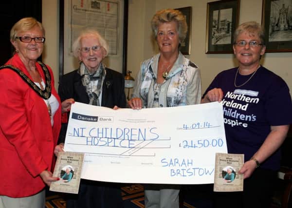 Mayor of Ballymena, Cllr. Audrey Wales, is pictured with Sarah Bristow, author of "Where History & Memories Meet", who raised £2450 from the sale of her book, present the cheque to Samina Bonar and Catherine O'Hara of the NI Childrens Hospice. INBT37-203AC