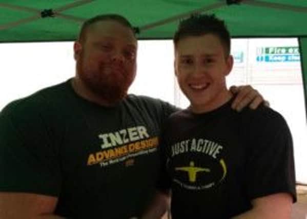 Larne's Andrew Falconer (right) with strongman Benni Magnusson