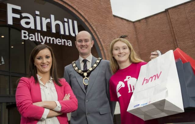 Fairhill Marketing & Commercial Manager, Natalie Jackson is pictured with Alan Stewart, President of Ballymena Borough Chamber of Commerce and Industry and Sarah McWhirter of music and games retailer HMV. HMV is one of three new tenants now open in Fairhill, the other two new stores are fashion retailers Tommy Hilfiger and Quiz. 28 full and part-time jobs have been created thanks to the new openings.  Picture by Brian Morrison.
