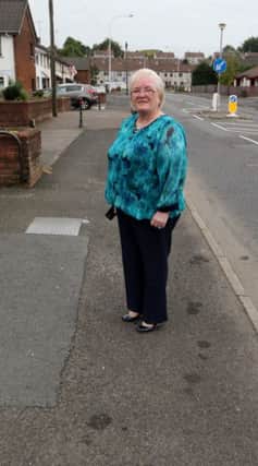 Cllr Beth Adger on the stretch of pavement at Wakehurst Road which is to be replaced. INBT 37-100JC