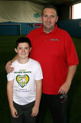 Clifford Adams with his son Kyle who is taking part in the Helping Hearts 5k family run. INBT37-205AC