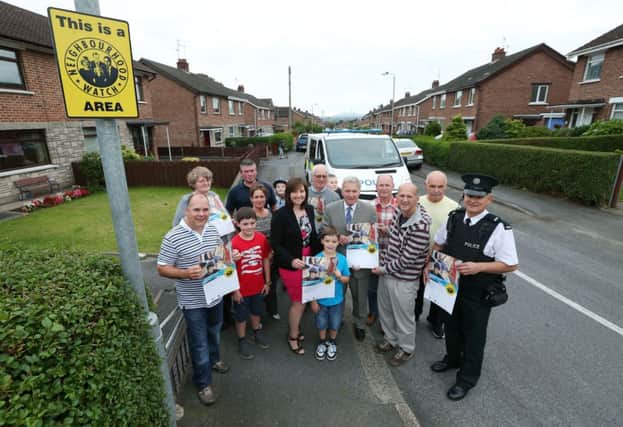 Councillor Brian Bloomfield, Chairman of the Lisburn PCSP launches the Beechdene Gardens Neighbourhood Watch Scheme with members of the PCSP, PSNI and the local community.
