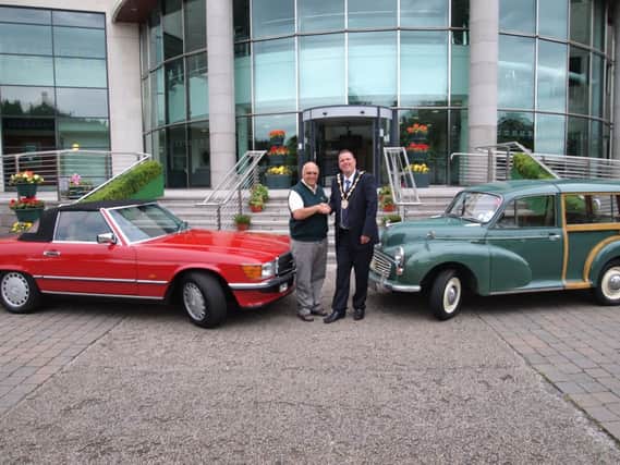 The Mayor of Lisburn, Councillor Andrew Ewing meets up with Sammy Spence, Chairman of the Lisburn City Old Vehicle Club to discuss the Classic Car Run on 13th September for Marie Curie Cancer Care.