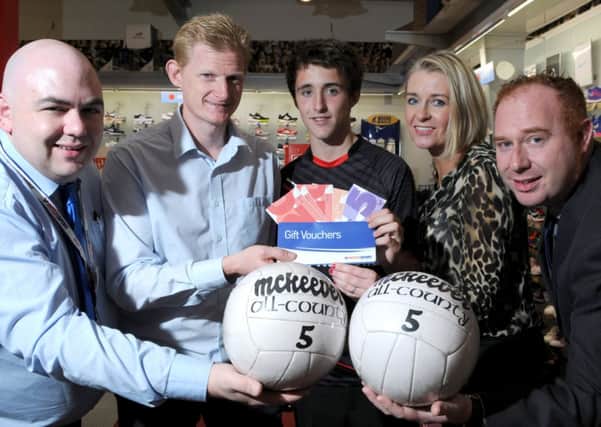 John McConnell of McConnell's Intersport Cookstown pictured as he presents James Devlin with his £50 worth of winning vouchers after he was named the Mid-Ulster Mail & Tyrone Times Sports Personality for the Month of August. Included in the picture are Shauna Burns (Ulster Bank), Gerard McSloy (Store Manager) and Patrick Cullen (Mid-Ulster Mail & Tyrone Times Advertising Team Leader).INTT3714-304