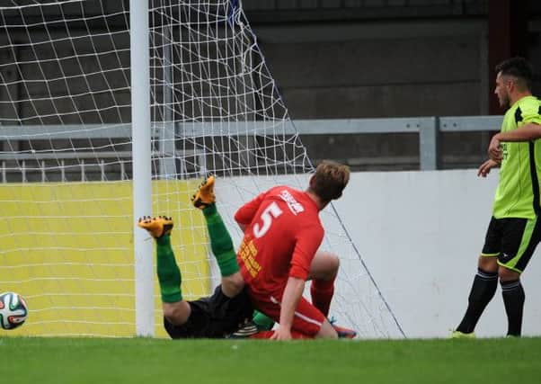 Jordan Hughes (Knockbreda) scores the only goal of the game. Photo: Presseye