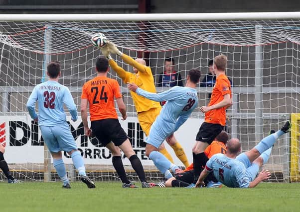 Glenavon goalkeeper Alan Blayney makes a superb save to keep out Paddy McLaughlin's strike. Picture by Lorcan Doherty/Presseye.com
