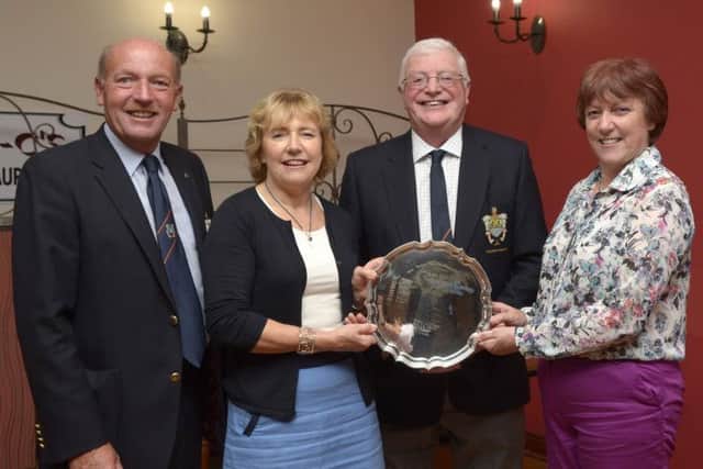 Jane Boyce and Susan Magennis presented the Teddy Holton Memorial Salver for the winner of the 2014 Past Captain's Competition to Bertie Shaw, included is Immediate Past Captain Declan Dooher © Edward Byrne Photography INBL1436-207EB