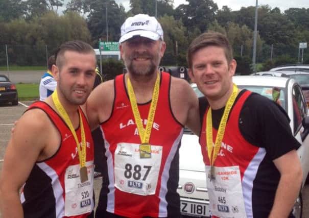 Larne Athletic Club's Thomas Craig, Robin Alexander and Bobby Boal at the Laganside 10k. INLT 37-904-CON