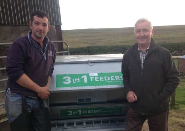 Thomas Gibson (left) is presented with his new 3in1 feeder by NSA Northern Ireland Regional Chairman John Blaney.