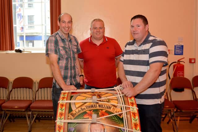 Stewrt Campbell, Gary Chambers and Gary Brown at the Lambeg Drumming competition in Carrick town hall. INCT 27-140-GR