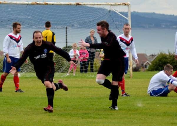 Danny Hastings celebrates after scoring Whitehead Rangers 3rd goal in their 3-1 over local rivals F.C. Larne. Photo: Graham Ross