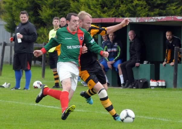 Larne Tech OB and Barn United battle for possession in their Border Cup clash.