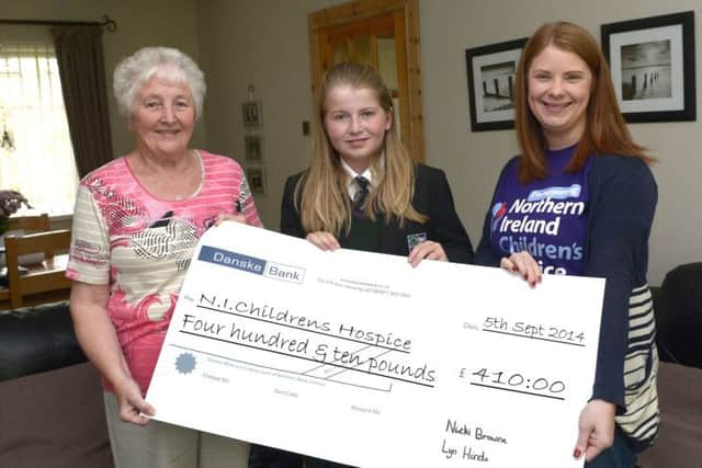 Lyn Hinds and granddaughter Nicki Browne presented a cheque for £410:00, proceeds from a Coffee Morning, to Community Fundraiser for NI Childrens Hospice Jenay Doyle © Edward Byrne Photography INBL1436-210EB