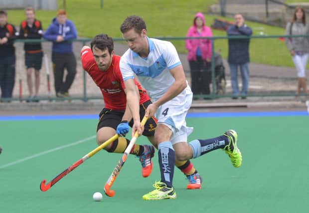 Lisnagarvey's Jonny Bell and Banbridge's Drew Carlisle in action in the Anderson Cup final. Pic by  Rowland White / PessEye
