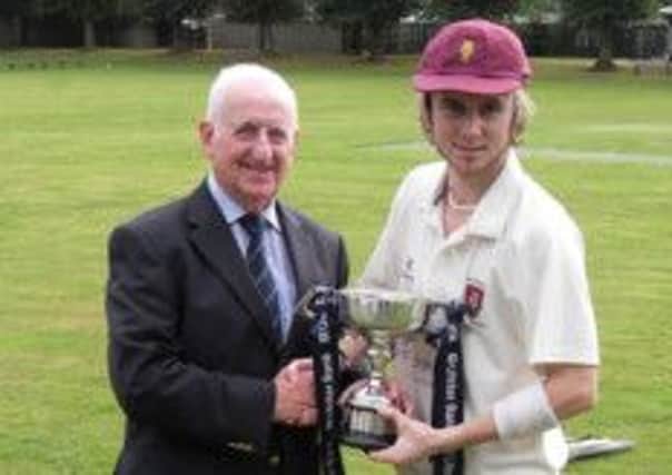 NCU President Billy Boyd presents Academy skipper Matthew Palmer with the Section 2 League trophy.