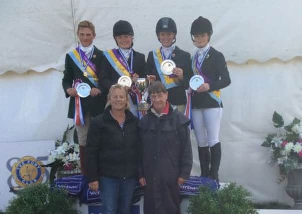 The Killultagh Open Show jumping Team, from left Daniel Brown, Jemma Parkhill, Charlotte Creighton, Katie Lyttle, Margaret Creighton, District Commissioner and Margie Lowry, Trainer.