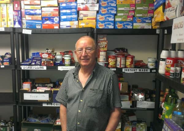 Alan Turner, Larne foodbank co-ordinator, pictured with some of the donated items stored at Craigyhill Methodist Church.  INLT 29-680-CON
