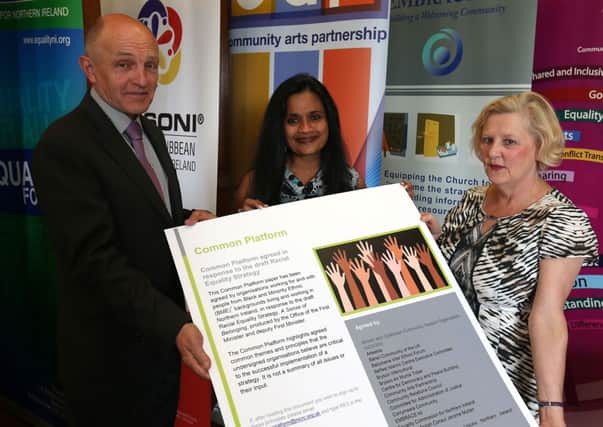 Ivy Goddard, centre, of Ballymena Inter Ethnic Forum helps launch a major response to the NI Executives Racial Equality Strategy at Stormont. Ivy is pictured with Michael Wardlow, Chief Commissioner at NI Equality Commission and Deirdre MacBride, Director of Cultural Diversity at the Community Relations Council. Ballymena Inter Ethnic Forum has joined with more than 20 other organisations to produce a response to the Draft Racial Equality Strategy. They are calling for the strategy to be more ambitious, far-reaching and robust. ©Presseye,Northern Ireland - 2014  Picture by Brian Thompson/Presseye