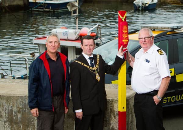 Mayor of Coleraine, Councillor George Duddy, HM Coastguard, Gordon Munro and Ricky McArthur, Portstewart Harbour Master and Coleraine Borough Council's Marina Superintendent.