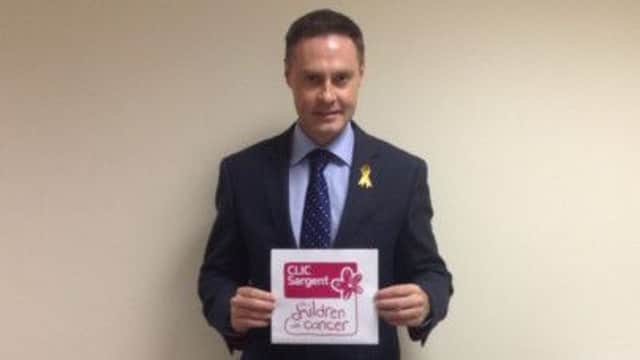 Paul Frew DUP MLA for North Antrim will be wearing a gold ribbon this September to support Childhood Cancer Awareness Month. inbm38-14s