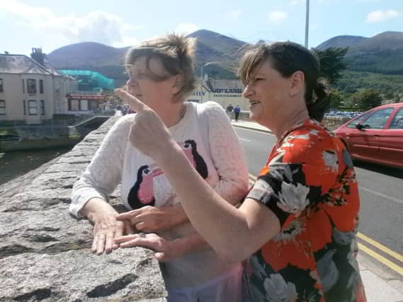 Project volunteer Justine Quinn (right)  enjoys the seaside view with Link Me beneficiary Mary Leitch. INCT 38-705-CON
