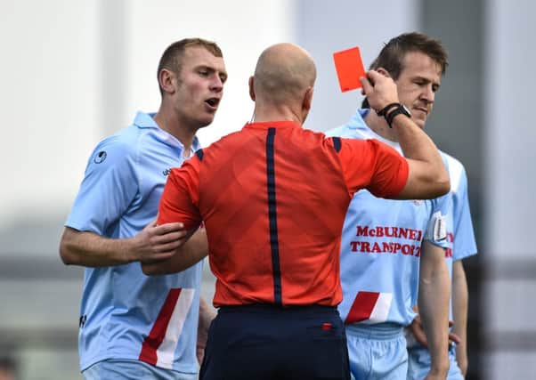 Ballymena United's Johnny Taylor's appeals are in vain as referee Arnold Hunter sends off United skipper Allan Jenkins inside the opening five minutes of today's Danske Bank Premiership game against Glentoran. Picture: Press Eye,