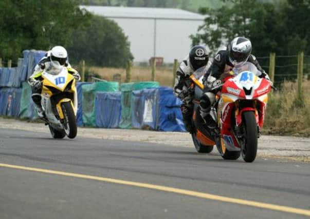 Battle of the local men. Robert Kennedy leads Christian Elkin and Jamie Patterson at St. Angelo. Picture: Roy Adams.