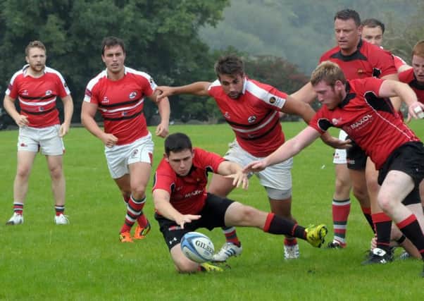 Larne and Carrick try to gain control of this loose ball at Glynn INLT 38-219-AM