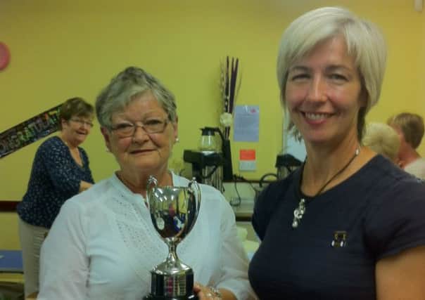 Winner of the Competition Trophy Jean Haveron is congratulated byTracey McIlwaine, WI executive officer, from Ballynure WI. INLT 38-653-CON