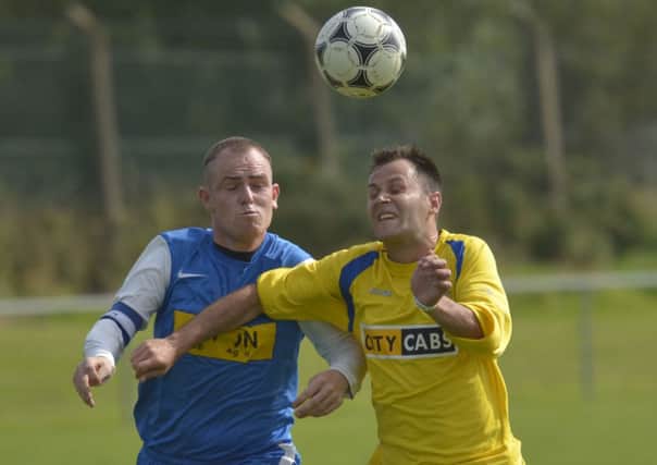 Churchill United striker Jonny Brothers tussles for the ball with Newton Forest skipper Andy Grey. INLS3714-119KM