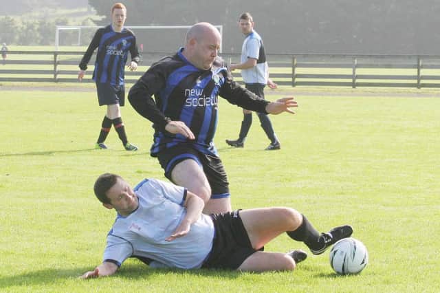 Hazelbank's Colin McClarty does battle with Johnny Millar. INCR38 FOOTY TILES