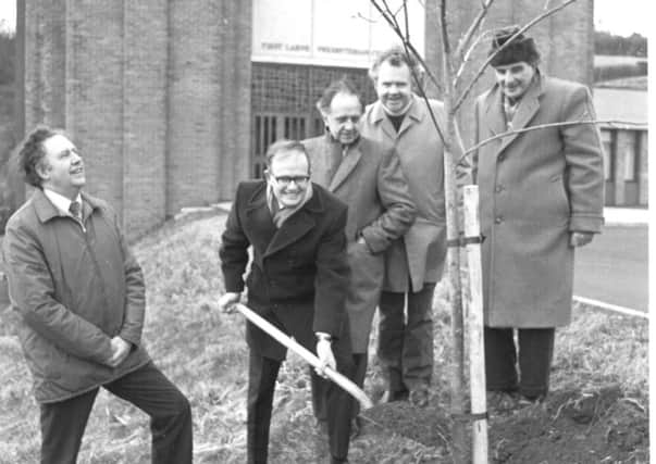A group from First Larne Presbyterian planting the Rowan Tree after the church moved from its former location on Bridge Street in 1978. The tree still stands.  INLT 36-678-CON