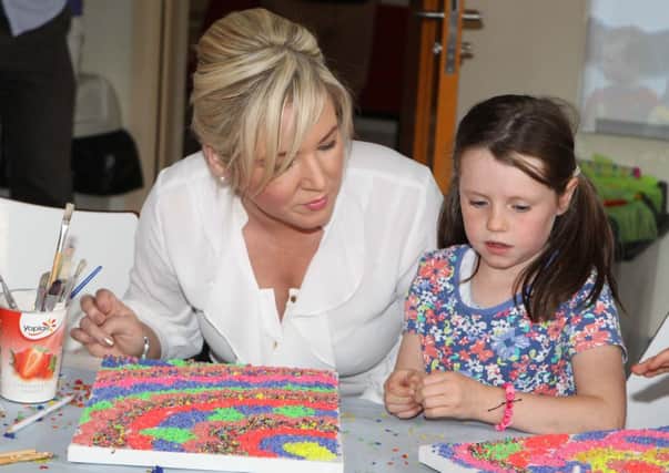 Cara McNaughton with Minister Michelle O'Neill at the official opening of the Glens of Antrim Youth Club