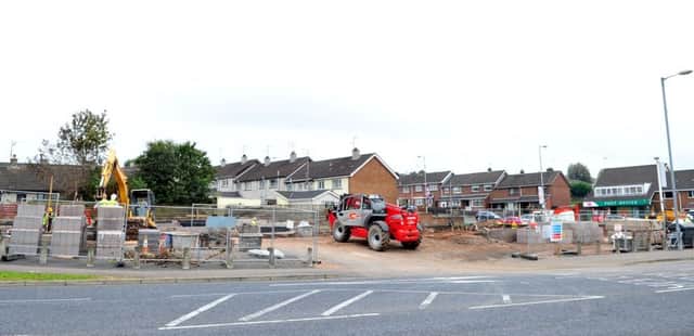 Workmen at old Rodney Cole site in Cookstown, where new KFC will be located. INMM3814-400