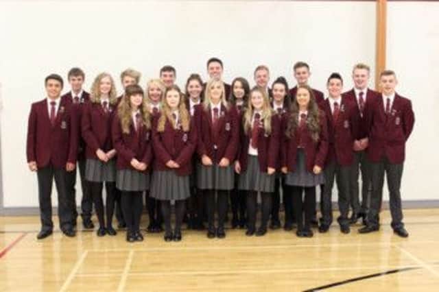 Ulidia Integrated College welcomed Irene McCready from the NSPCC to train new mentors. Pictured are Year 13 mentors with senior prefect Sarah Ashe (middle of front row). INCT 38-797-CON