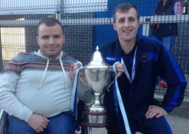 John Johnston, pictured alongside Stephen Curry with the Championship One trophy.