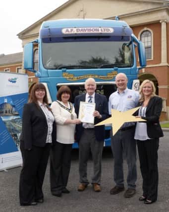 LOCAL COMPANY WINS GOLD FOR SERVICE EXCELLENCE Local company A F Davison Ltd are celebrating after recently becoming the first haulage company in Ireland to win a prestigious EFQM Gold Star for Service Excellence.  Representatives from the company were invited to attend a special reception at Banbridge District Council Civic Building on Tuesday 16 September where they were honoured by Council Chairman, Councillor Marie Hamilton in recognition of their of achievement. The EFQM (European Foundation for Quality Management) Gold Star Excellence programme was a joint business improvement initiative between Banbridge District Council and the Centre for Competitiveness.  The programme was designed to aid local companies in implementing effective international customer service practices, thereby benefitting the companies both at home and abroad.  A F Davison Ltd enrolled in the programme in early 2013 and were awarded the Gold Star in June 2014.  The company was established over 40 years ago and have proven record in