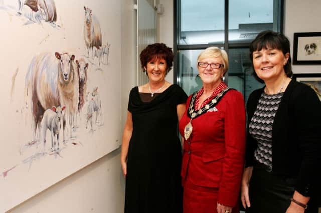 Jacque McNeill is pictured at the launch of her art exhibition titled "Field and Farm" at The Braid along with the Mayor of Ballymena, Cllr. Audrey Wales, and Julie Connor who launched the exhibition. INBT38-202AC