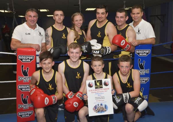 Gary Martin, left, and Nigel Hagon, coaches, pictured with some of the members of Rochester's Amateur Boxing Club, from left, front row, Marcus McCorkell, Jake McCloskey, D Jay Dougherty and Andrew Beil, back row, Jordan Simpson, Suzy Kennedy, Justin Black and Seamus Kearney, who are looking forward to the Gala Boxing Show in the Waterside Theatre, which takes place next month. INLS3814-114KM
